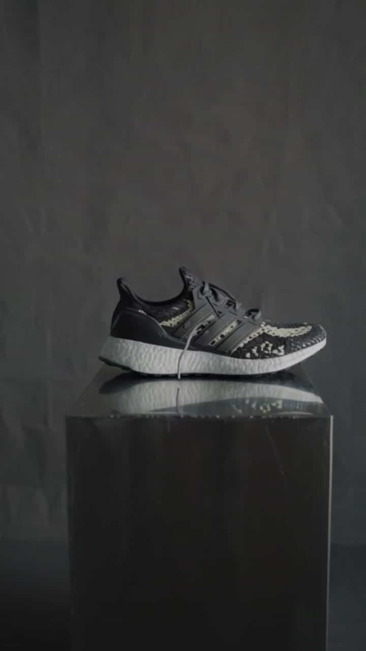 Luma Ray 3.2 AI video example: A premium running shoe on a clean studio plinth, vertical social crop, slow rising camera move, soft side...