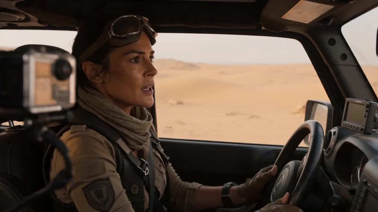 Seedance 2.0 Fast AI video example: Create a 12-second cinematic multi-shot commercial sequence in 16:9. Scene: A vast desert action-adve...