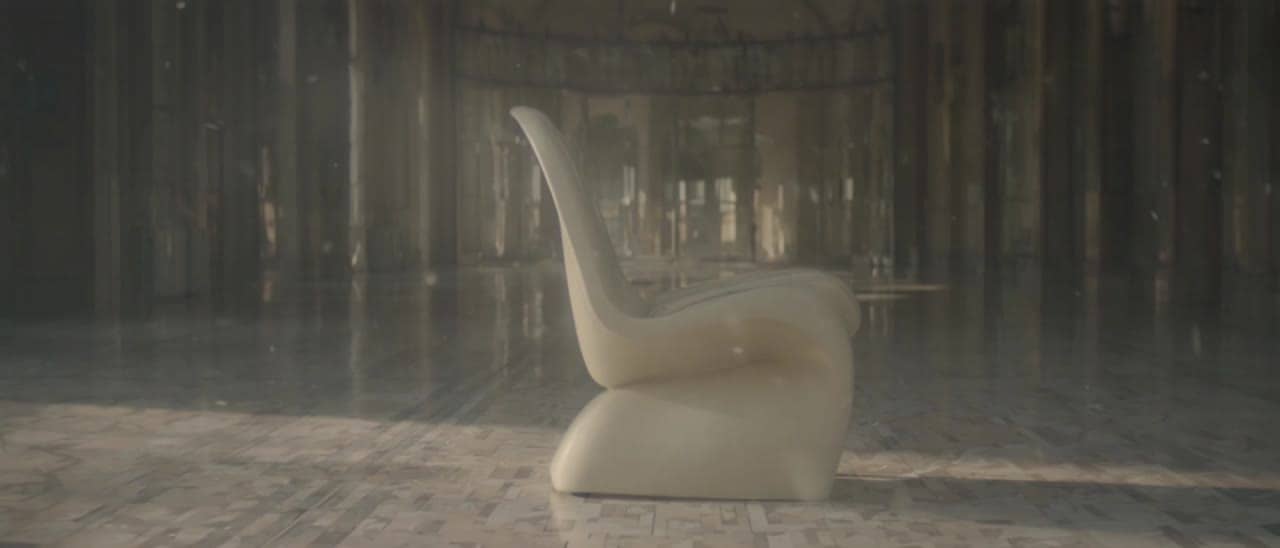 Luma Ray 3.2 a quiet editorial shot of a sculptural cream chair in a s...