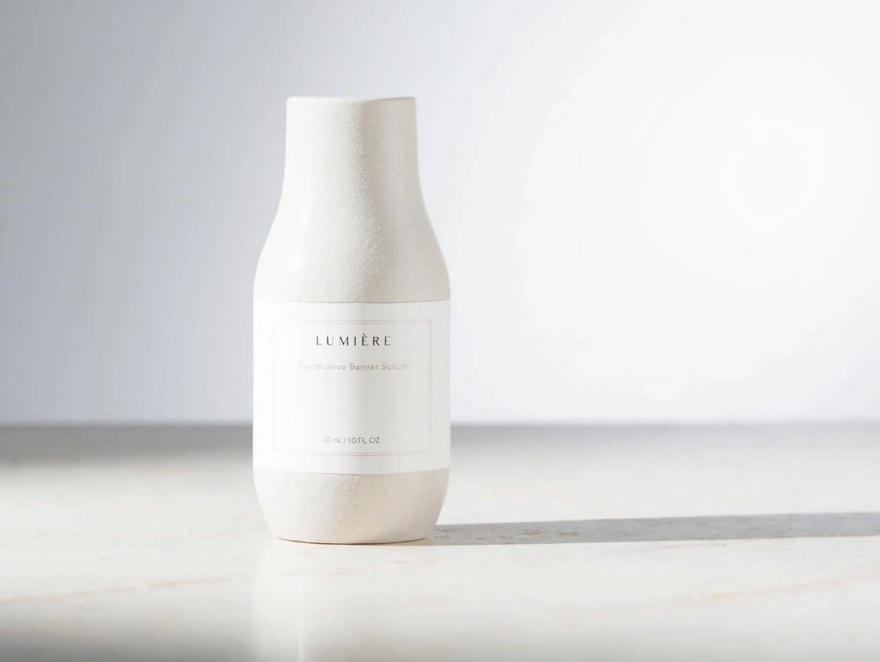 Luma Ray 3.2 animate the skincare bottle still with a gentle clockwise...