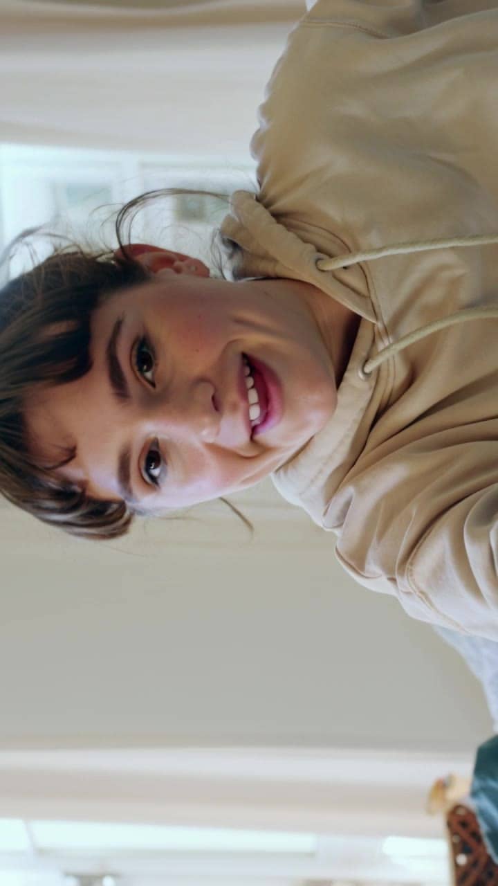 Kling 3 Standard AI video example: Vertical 9:16 TikTok-style UGC selfie video, handheld smartphone feel, natural indoor daylight near a...