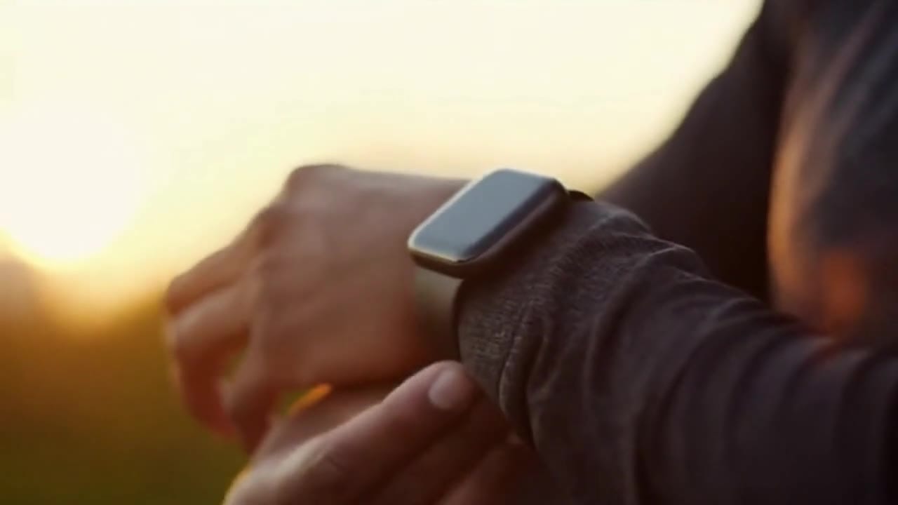 OpenAI Sora 2 AI video example: 8 second cinematic lifestyle commercial of a man in his 30s using a sleek smartwatch while jogging at sun...