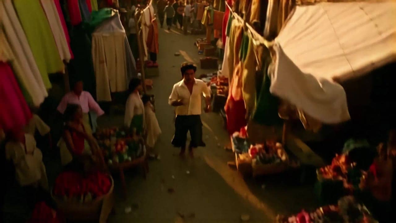 LTX Video 2.0 Pro AI video example: 8 - 10 second 16:9 4K cinematic shot in a vibrant Middle Eastern souk at sunset. The camera starts hi...