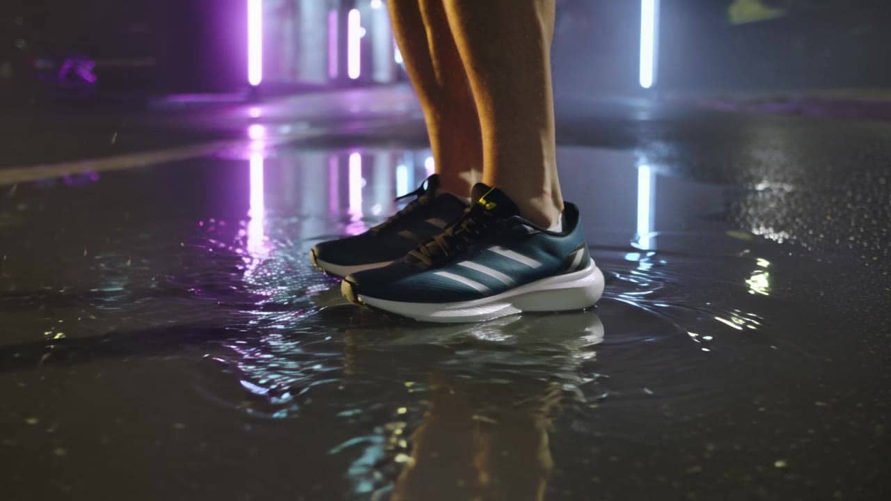 Kling 3 Standard AI video example: Multi-shot (Text→Video). 15s. 16:9. Audio: on. Scene anchors: Night city street after rain, wet asphal...