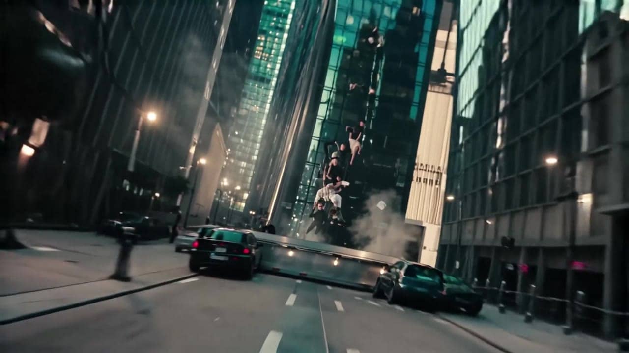 LTX Video 2.0 Pro AI video example: 8-second 16:9 4K dreamlike shot of a modern city street suddenly folding upward like a giant book. Th...