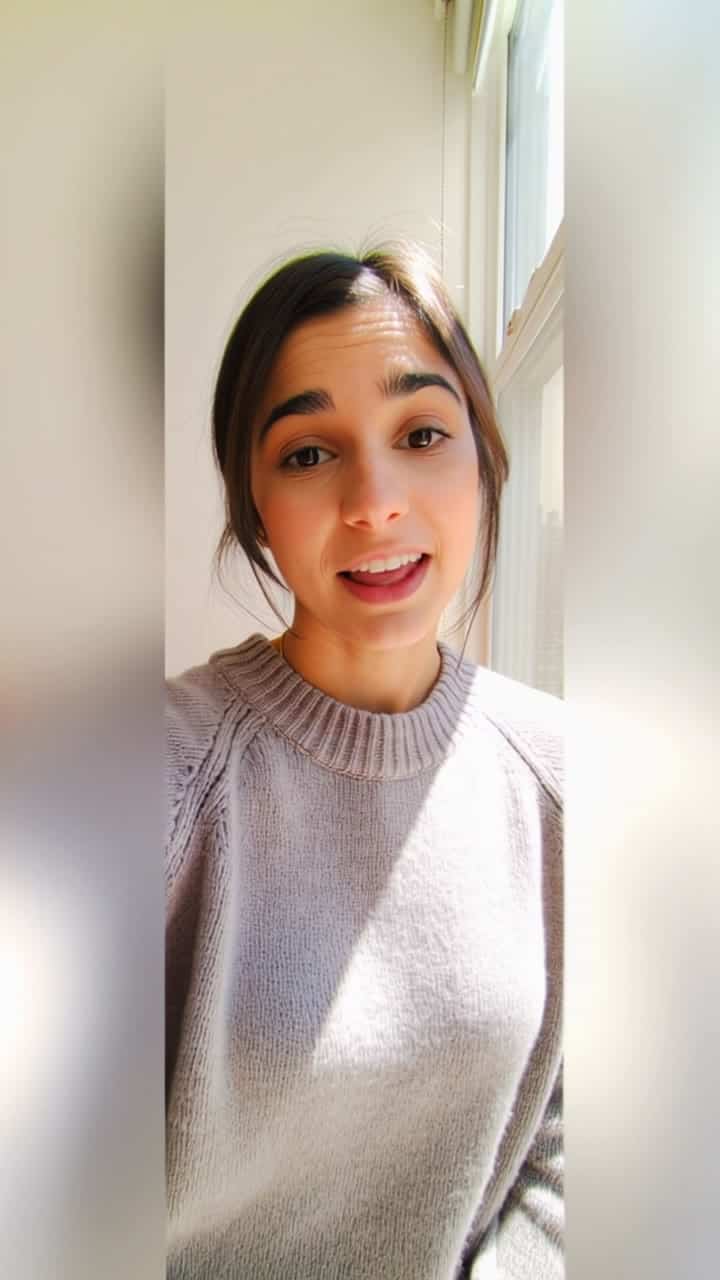 Kling 2.6 Pro AI video example: Vertical 9:16 TikTok-style UGC selfie video, handheld smartphone feel, natural indoor daylight near a win...